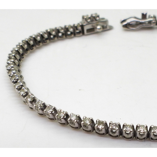 2813 - A DIAMOND LINE BRACELETmounted in 9ct white gold, set with sixty-two x 0.025ct brilliant cut diamond... 