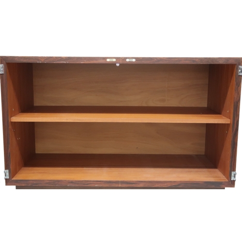 2092 - A MID 20TH CENTURY ROSEWOOD TREVOR CHINN F.S.I.A.D. FOR GORDON RUSSELL TWO DOOR CABINET with shaped ... 