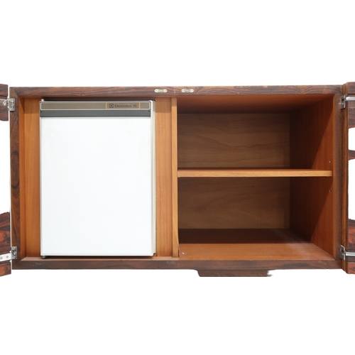 2093 - A MID 20TH CENTURY ROSEWOOD TREVOR CHINN F.S.I.A.D. FOR GORDON RUSSELL SIDEBOARD with four cabinet d... 