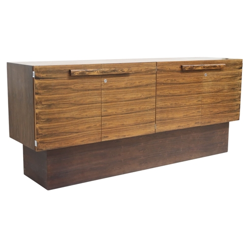 2093 - A MID 20TH CENTURY ROSEWOOD TREVOR CHINN F.S.I.A.D. FOR GORDON RUSSELL SIDEBOARD with four cabinet d... 