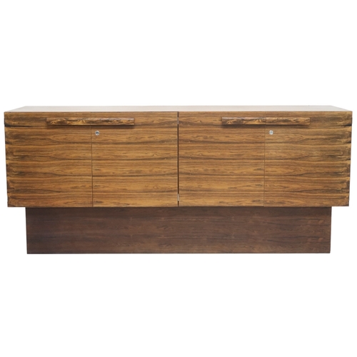 2093 - A MID 20TH CENTURY ROSEWOOD TREVOR CHINN F.S.I.A.D. FOR GORDON RUSSELL SIDEBOARD with four cabinet d... 