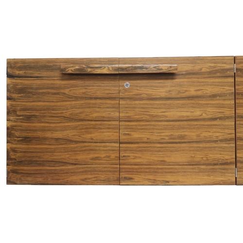 2093 - A MID 20TH CENTURY ROSEWOOD TREVOR CHINN F.S.I.A.D. FOR GORDON RUSSELL SIDEBOARD with four cabinet d... 