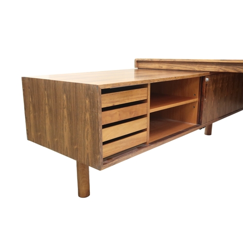 2094 - A MID 20TH CENTURY ROSEWOOD TREVOR CHINN F.S.I.A.D. FOR GORDON RUSSELL L SHAPED DESKwith three drawe... 