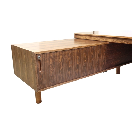 2094 - A MID 20TH CENTURY ROSEWOOD TREVOR CHINN F.S.I.A.D. FOR GORDON RUSSELL L SHAPED DESKwith three drawe... 