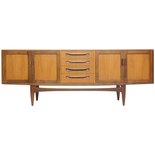 2095 - A MID 20TH CENTURY TEAK G PLAN SIDEBOARD with four central drawers flanked by a pair of cabinet... 