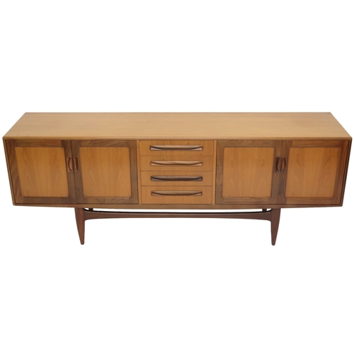 2095 - A MID 20TH CENTURY TEAK G PLAN SIDEBOARD with four central drawers flanked by a pair of cabinet... 