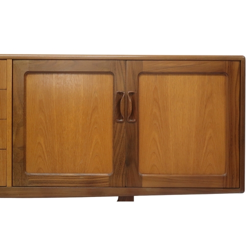 2095 - A MID 20TH CENTURY TEAK G PLAN SIDEBOARD with four central drawers flanked by a pair of cabinet... 