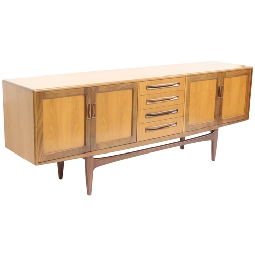 2095 - A MID 20TH CENTURY TEAK G PLAN SIDEBOARD with four central drawers flanked by a pair of cabinet... 