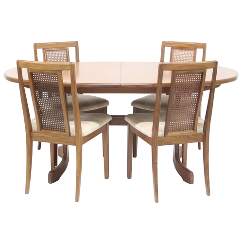 2096 - A MID 20TH CENTURY TEAK G PLAN DINING TABLE AND FOUR CHAIRS table with oval top concealing inte... 