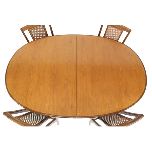 2096 - A MID 20TH CENTURY TEAK G PLAN DINING TABLE AND FOUR CHAIRS table with oval top concealing inte... 