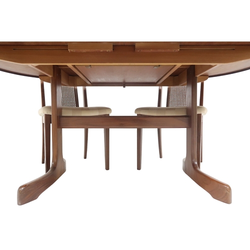 2096 - A MID 20TH CENTURY TEAK G PLAN DINING TABLE AND FOUR CHAIRS table with oval top concealing inte... 