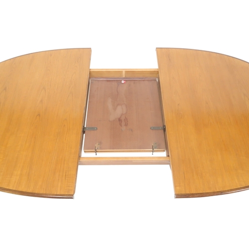 2096 - A MID 20TH CENTURY TEAK G PLAN DINING TABLE AND FOUR CHAIRS table with oval top concealing inte... 