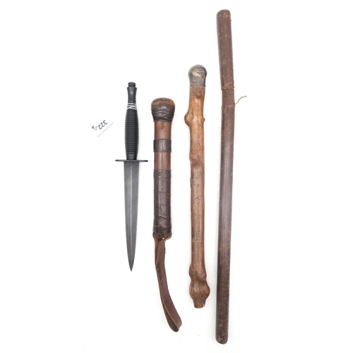 322 - A Fairbairn Sykes Third Pattern fighting knife, with black grip; together with a weighted cosh, leat... 