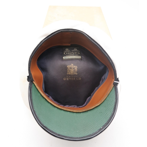 323 - A post-War Royal Navy officer's cap by Gieves Ltd. of London, with bullion oak leaf embroidery to pe... 