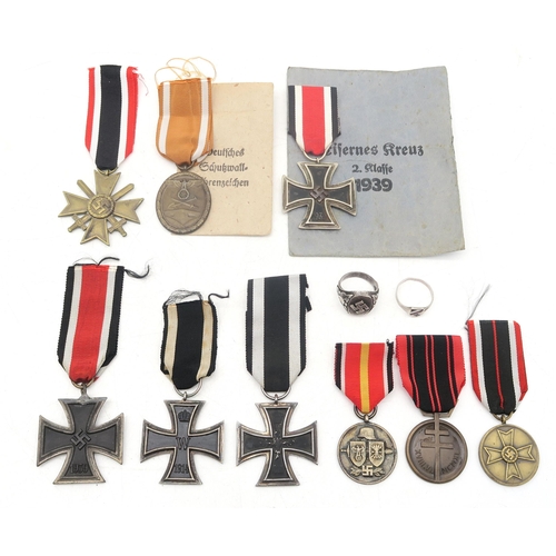 328 - A collection of German military medals, comprising Third Reich West Wall Medal, retaining issue pack... 