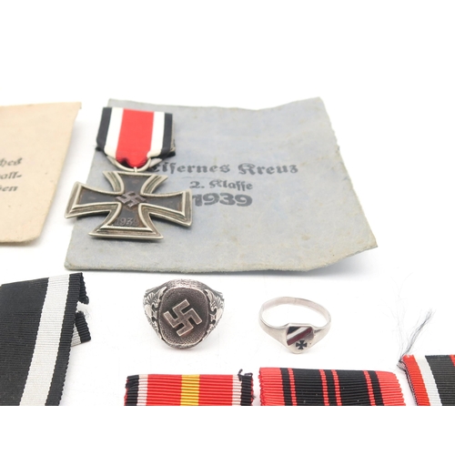 328 - A collection of German military medals, comprising Third Reich West Wall Medal, retaining issue pack... 