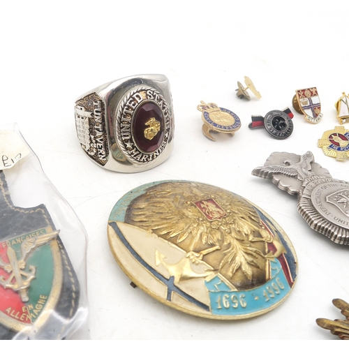 329 - Assorted military medals and badges, to include a French Order of the Black Star medal; Russian Orde... 