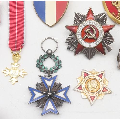 329 - Assorted military medals and badges, to include a French Order of the Black Star medal; Russian Orde... 