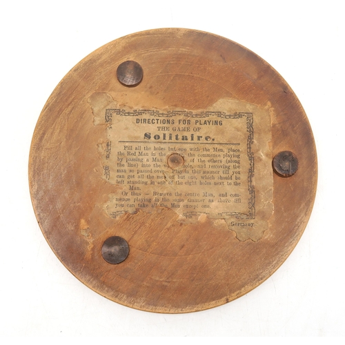 343 - A small German solitaire board, measuring approx. 19.5cm in diameter, with a collection of pontiled ... 