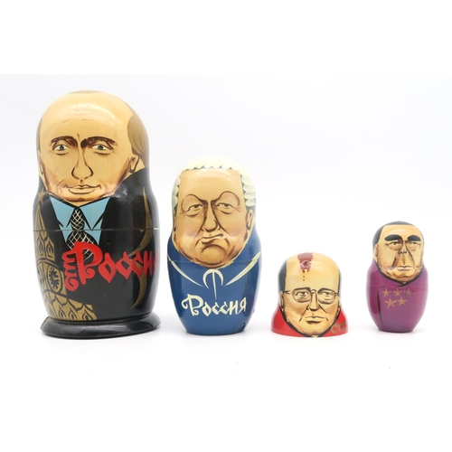 366 - A collection of Russian dolls, to include examples depicting 20th century Russian leaders, from Leni... 