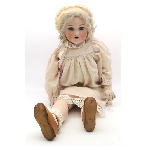 374 - A large Armand Marseilles doll with articulated limbs, marked to the back of the head 