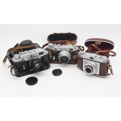 377 - An Olympus OM2N camera fitted with an OM-System S Zuiko Auto-Zoom 35-70mm 1:4 lens, Super Ozeck II A... 