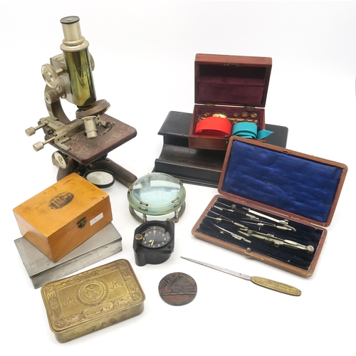 383 - An eclectic mixed lot, comprising a microscope by Prior of London, serial no. 10104, an ebonised des... 