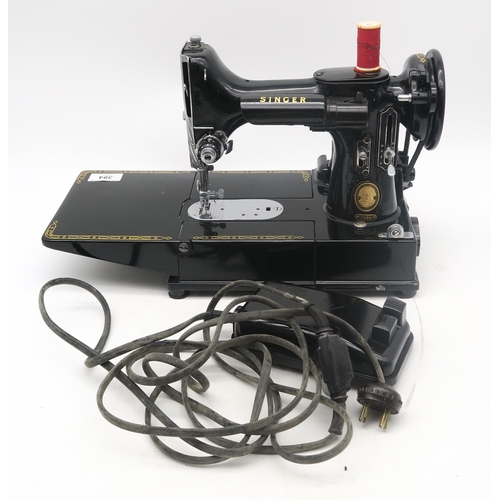 384 - A Singer 222K sewing machine, with case, pedal and accessories; together with a cased Everay High Fr... 