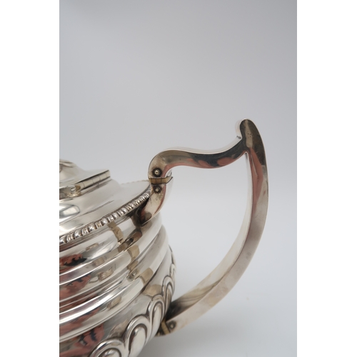 2548 - A GEORGE III THREE PIECE SILVER TEA SERVICEby Solomon Hougham, London 1813, of squat shaped form, th... 