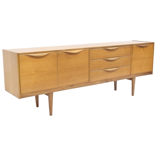 2099 - A MID 20TH CENTURY TEAK VICTOR WILKINS FOR G PLAN SIDEBOARD with three graduating drawers flank... 