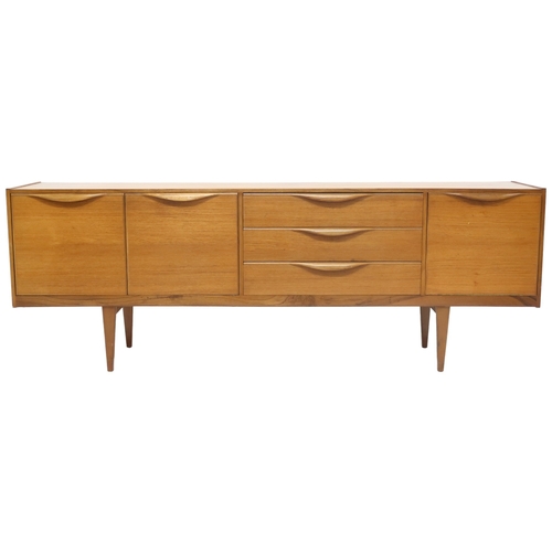 2099 - A MID 20TH CENTURY TEAK VICTOR WILKINS FOR G PLAN SIDEBOARD with three graduating drawers flank... 