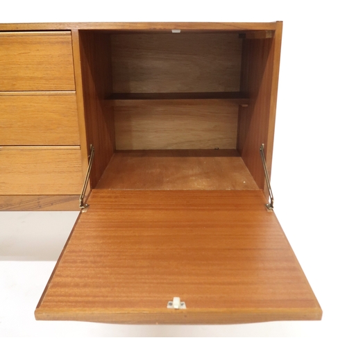 2099 - A MID 20TH CENTURY TEAK VICTOR WILKINS FOR G PLAN SIDEBOARD with three graduating drawers flank... 