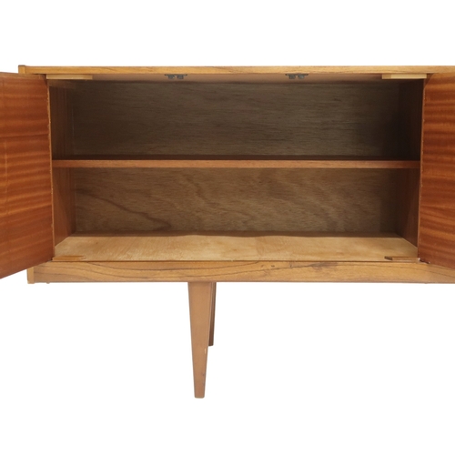 2099 - A MID 20TH CENTURY TEAK VICTOR WILKINS FOR G PLAN SIDEBOARD with three graduating drawers flank... 