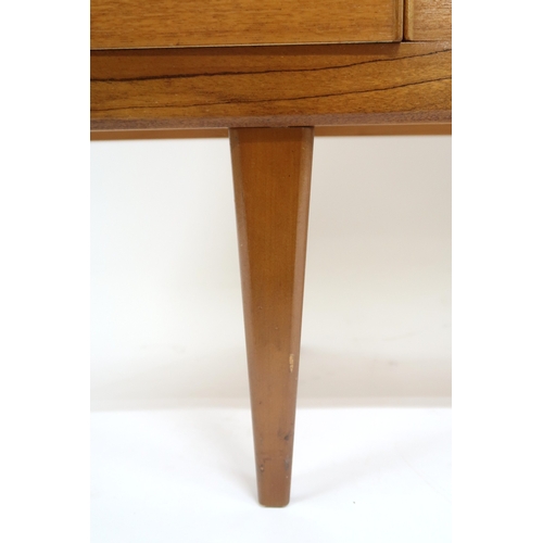 2099 - A MID 20TH CENTURY TEAK VICTOR WILKINS FOR G PLAN SIDEBOARD with three graduating drawers flank... 