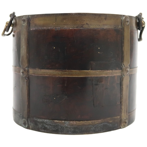 2045 - A 19TH CENTURY IRISH BRASS BOUND TWIN HANDLED BUCKET bearing brass plaque depicting the crown a... 