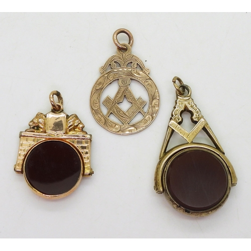 705 - A large 9ct gold Masonic swivel fob seal set with bloodstone and carnelian, a further 9ct Masonic me... 