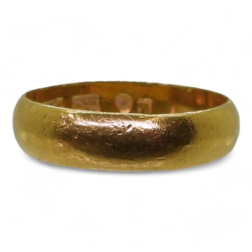 709 - A bright yellow metal wedding ring, stamped with Chinese characters and 96.5%, finger size X1/2, wei... 