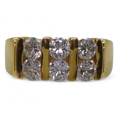 714 - A bright yellow metal ring, stamped 90%, set with six diamonds with a combined diamond total of esti... 