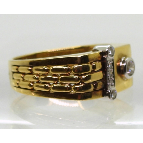 718 - A bright yellow metal ring stamped 750, set with diamonds with an estimated approx combined diamond ... 