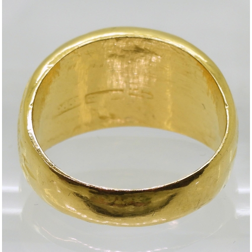 724 - A bright yellow metal dome ring with engraved detail, stamped with Chinese characters 96.9%, finger ... 