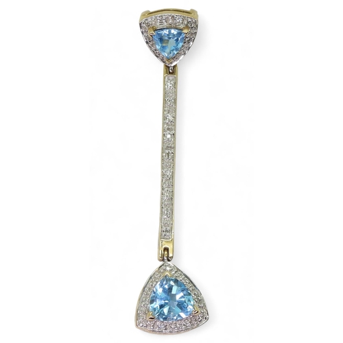 734 - A 9ct gold trilliant cut blue topaz and diamond accent pendant, length 5.3cm, weight 3.9gms