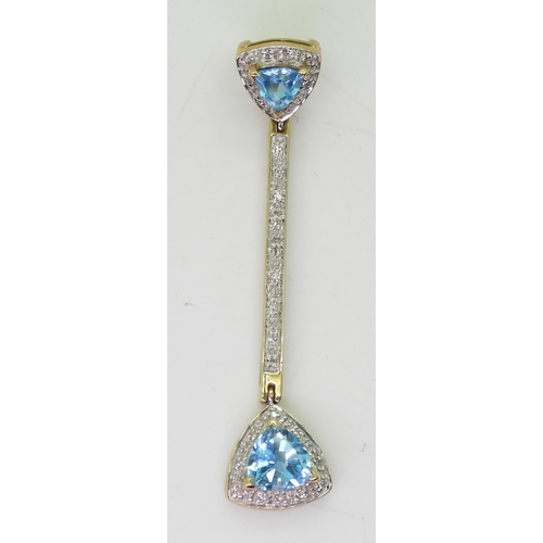 734 - A 9ct gold trilliant cut blue topaz and diamond accent pendant, length 5.3cm, weight 3.9gms