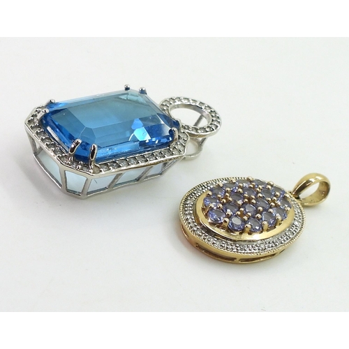 739 - A 9ct gold emerald cut blue topaz and diamond pendant, set with a blue topaz of approx 18mm x 13mm x... 