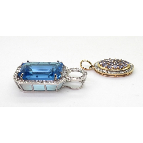 739 - A 9ct gold emerald cut blue topaz and diamond pendant, set with a blue topaz of approx 18mm x 13mm x... 