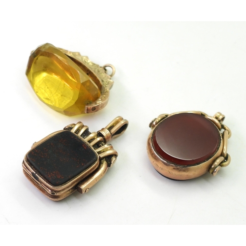 743 - Three vintage fob seals, a yellow glass fob seal in 9ct gold mount, hallmarked Chester 1902, a 9ct c... 