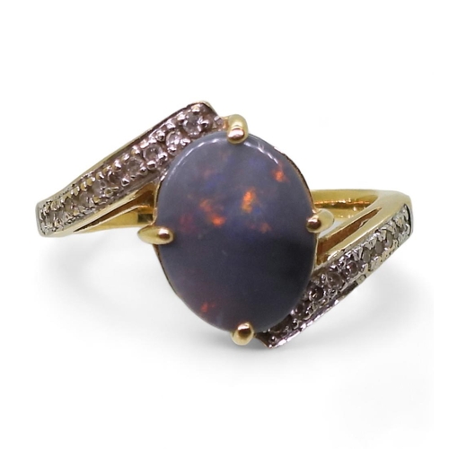 761 - An 18ct gold opal and diamond ring, finger size N1/2, weight 4.4gms