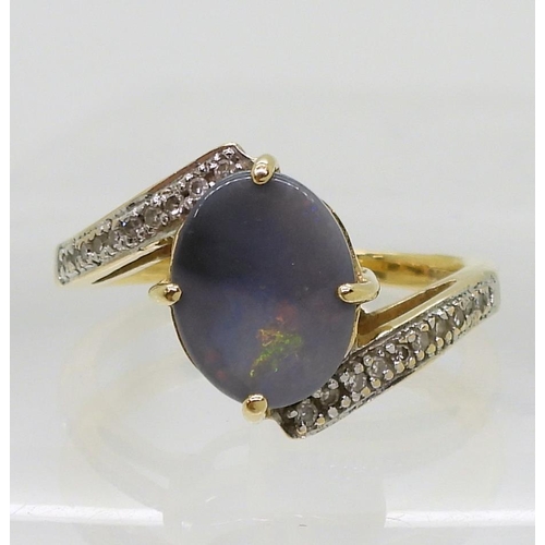 761 - An 18ct gold opal and diamond ring, finger size N1/2, weight 4.4gms