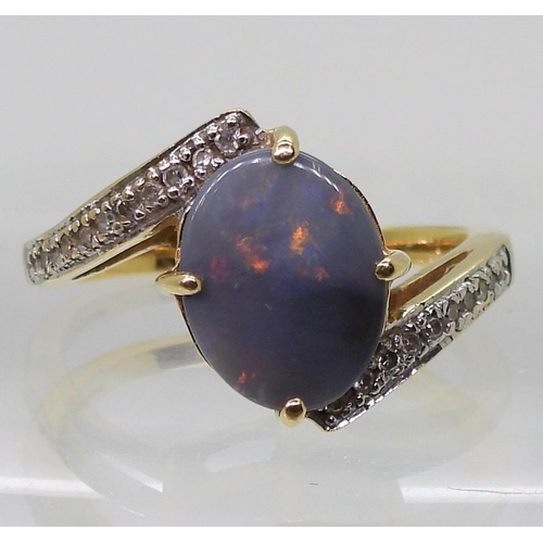 761 - An 18ct gold opal and diamond ring, finger size N1/2, weight 4.4gms