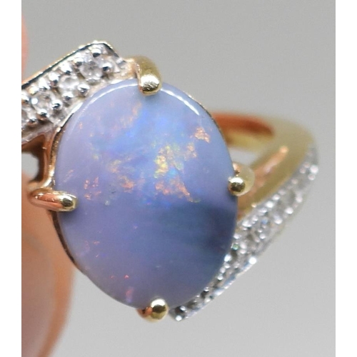 761 - An 18ct gold opal and diamond ring, finger size N1/2, weight 4.4gms