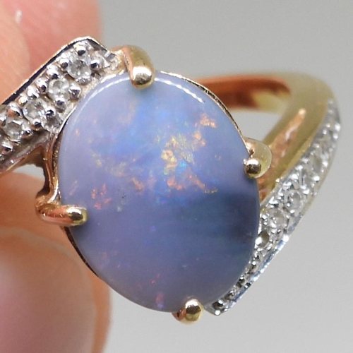 761 - An 18ct gold opal and diamond ring, finger size N1/2, weight 4.4gms